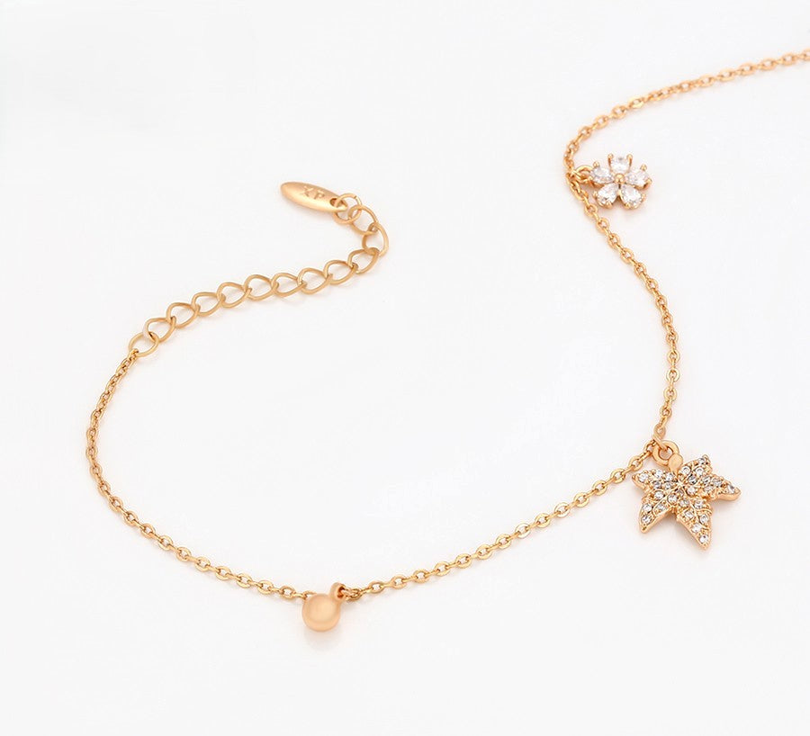 Delicate Gold Chain Bracelet with Leaf and Floral Charms and Sparkling Crystals