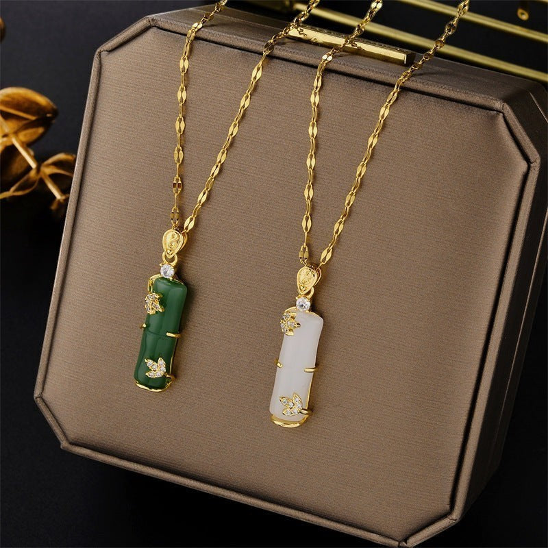 32lavender gold plated titanium steel necklace with green or white bamboo joint pendant and wavy chain, adorned with crystals.