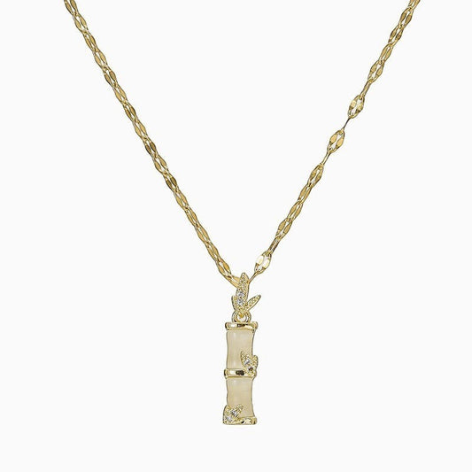 32lavender gold plated titanium steel necklace with bamboo joint pendant and wavy chain, adorned with small crystals.