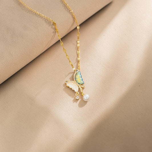 32lavender asymmetrical butterfly necklace with pearl and cubic zirconia accents, crafted from gold-tone titanium steel.