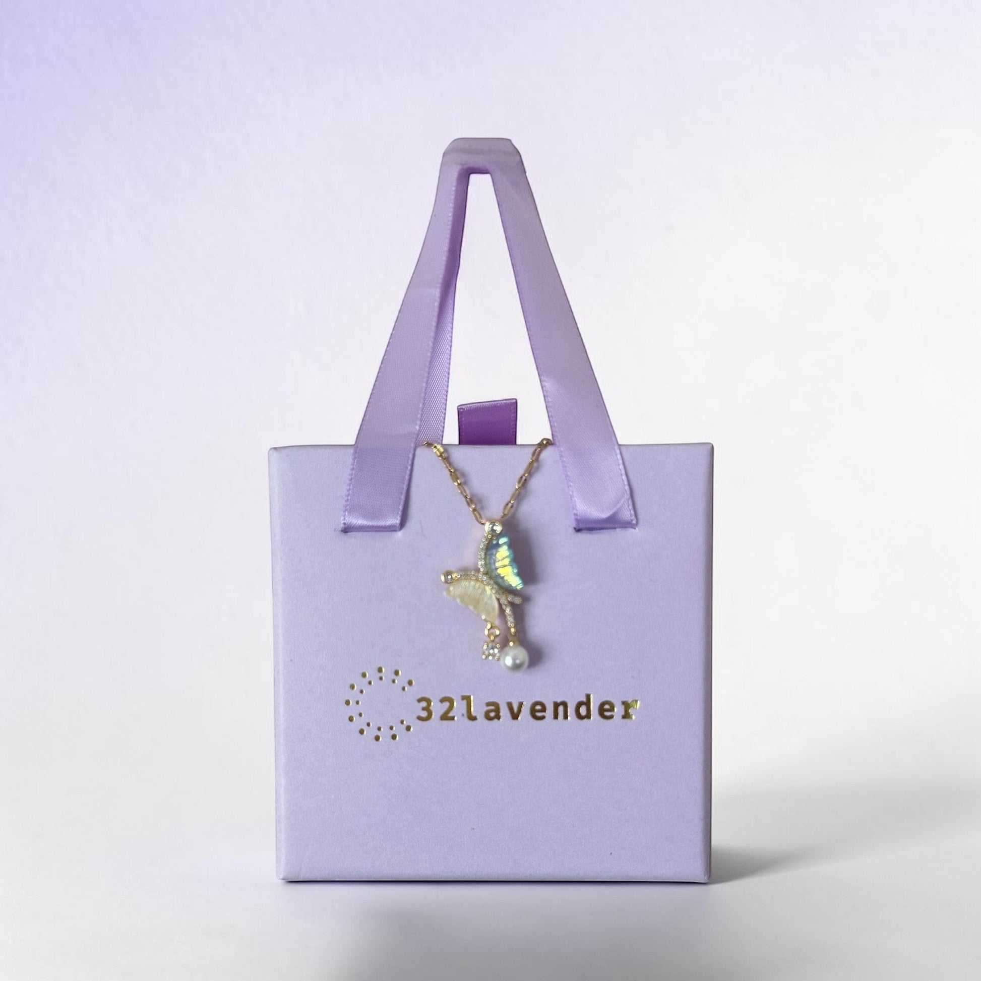 32lavender asymmetrical butterfly necklace with pearl and iridescent wings, made of titanium steel.