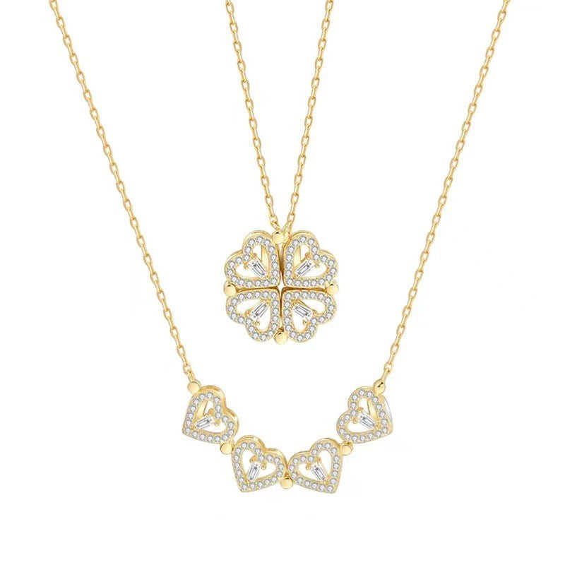 32lavender gold plated titanium steel necklace with a transformable four leaf clover pendant made of hearts and cubic zirconia.