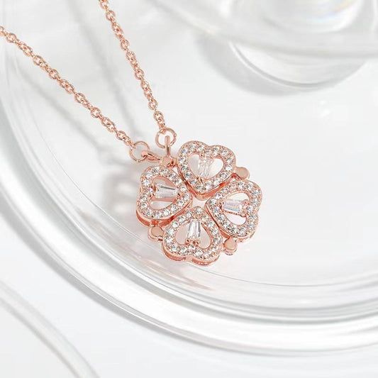 32lavender rose gold transformable necklace with four heart-shaped pendants that form a four-leaf clover, encrusted with crystals.