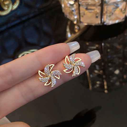 Whirling Pavé Pinwheel Stud Earrings | Gold Plated Kinetic Spinning Windmill Crystal Studs