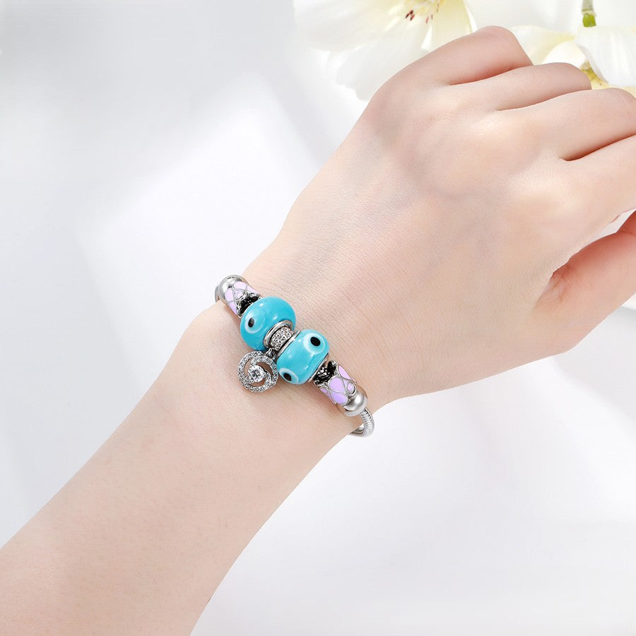 Platinum Plated Charm Bracelet | Ocean Blue Murano Glass Swirl Bead